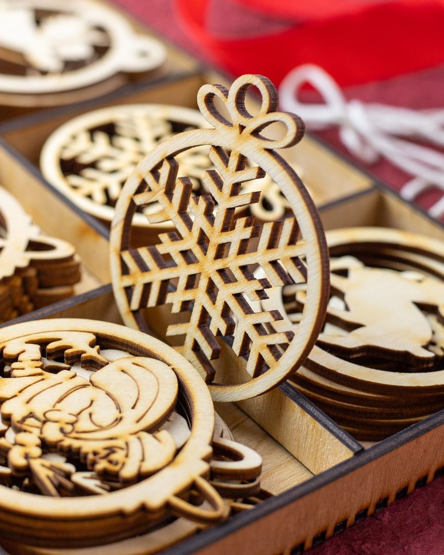 Box of laser-cut wooden Christmas ornaments