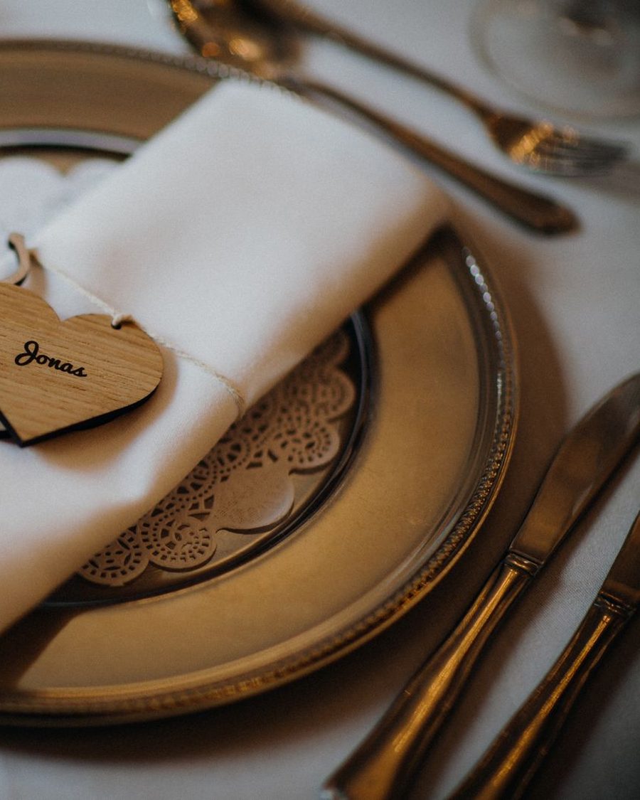 Wooden heart place card on a wedding table