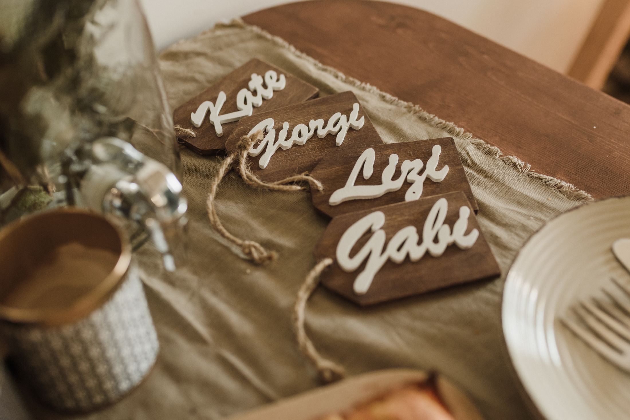 Laser-cut wooden wedding place cards with hand-lettered names