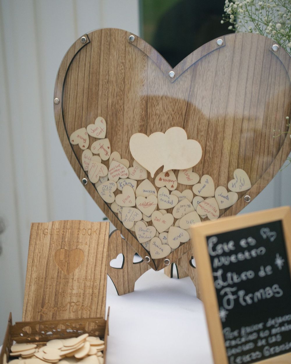 Wooden heart guest book at a wedding